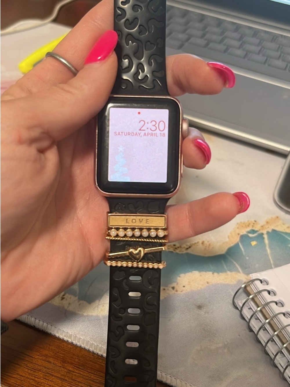 Apple Watch with Black Silicone Band and Gold Accent Charms
